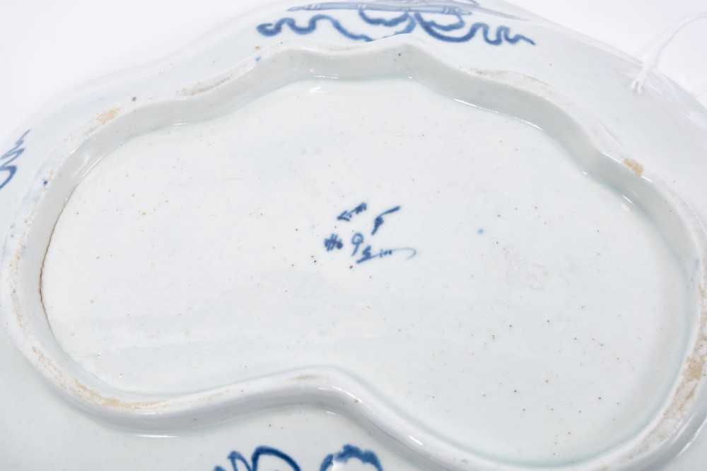 Pair of Bow blue and white kidney-shaped dishes, circa 1760, the central panel painted with a fisher - Image 2 of 5