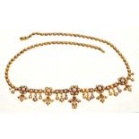 Late Victorian gold and seed pearl fringe necklace, the articulated links with flower head clusters