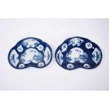 Pair of Bow blue and white kidney-shaped dishes, circa 1760, the central panel painted with a fisher