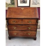 George III mahogany bureau, hinged fall enclosing fitted interior and three long graduated drawers b