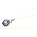 Blue topaz, ruby and diamond pendant in 14ct white gold setting