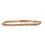 Edwardian 9ct rose gold and white enamel gate bracelet