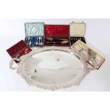 Silver plated oval two-handled tray and a selection of plated flatware.