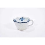 Bow blue and white butter boat, circa 1765, painted with floral sprays, 8.5cm length