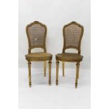 Pair of 19th century French giltwood side chairs with caned seats