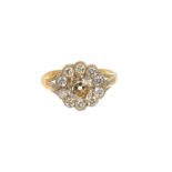 Diamond flower head cluster ring with a central cushion-shape old cut diamond estimated approximatel