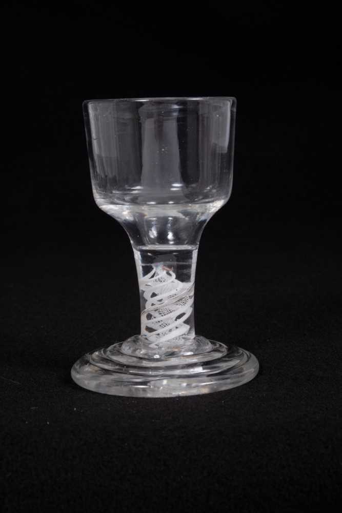 Georgian firing glass, with an ogee bowl on a double series opaque twist stem, above a stepped foot,