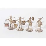 Four Contemporary Far Eastern silver figures in the form of various tradesmen.