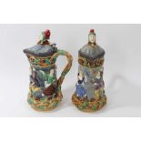 A matched pair of Minton Majolica 'Tower' jugs, 1881 and 1883, 33cm height