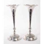 Pair of large Silver Trumpet Vases with knopped stems on circular fluted bases.