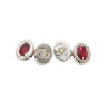Pair of diamond and ruby cufflinks, the oval white gold panels set with a brilliant cut diamond and