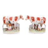Pair Staffordshire pottery cow and milkmaid groups circa 1870