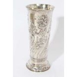 late Victorian silver vase with embossed floral decoration in the Art Nouveau style.