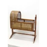 Regency mahogany baby's cradle with caned panels