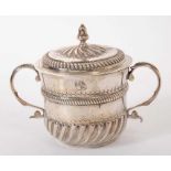 A William and Mary silver porringer and associated cover
