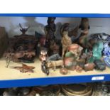 Collection of carved wooden figures and ornaments, and a Black Forest clock
