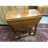 Oak drop leaf table with turned legs joined by stretchers