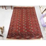 Eastern rug with geometric decoration on red ground