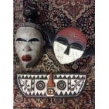 Three carved wood tribal masks
