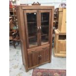 Contemporary display cabinet with two glazed doors, drawer and cupboards below