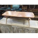 Ercol light elm coffee table with magazine rack undertier