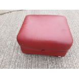 Contemporary red leather footstool with hinged lid