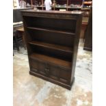 Pair of Ercol open bookcases cupboards below