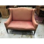 Edwardian two seater sofa with arched back, on square taper legs