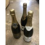 Three bottles of vintage champagne