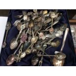 Box of souvenir spoons, including silver and enamel examples