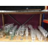 Selection of cut wine glasses and tumblers, green wine glasses and punch tankards
