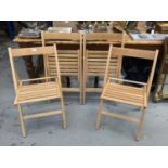 Set of four beech folding chairs