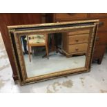 Bevelled wall mirror in ornate gilt frame