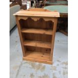 Modern pine narrow open bookcase with three shelves to interior together with another similar bookca