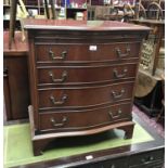 Mahogany serpentine fronted chest with brushing slide and three drawers below