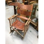 Folding chair with embossed leather seat and back