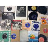 Selection of interesting single records including Bowie, Manish Boys, Alice Cooper and framed photog
