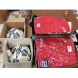 Two boxes England football polo tops, other sports T-shirt’s and two Carlsberg footballs