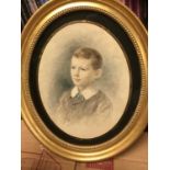 English School, early 20th century watercolour of a child, oval glazed frame
