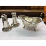 Silver sauce boat and pair silver salt and pepper castors