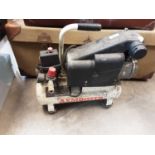 Electric air compressor and a Ryobi petrol leaf blower