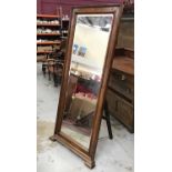 Large bevelled mirror in walnut frame with easel back