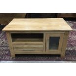 Light oak TV stand with glazed door, shelf and drawer below