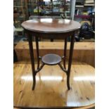 Edwardian inlaid mahogany circular two tier occasional table on splayed legs