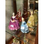 Four Royal Doulton figurines, including Charlotte, Grandmother's Dress, Top o' the Hill, and A Child