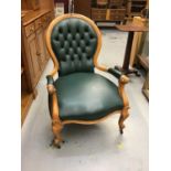 Victorian open beech armchair with buttoned green leather upholstery on cabriole legs