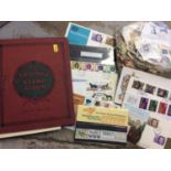 Triumph stamp album together with a bag of loose stamps