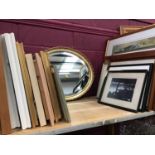 Bevelled edge oval mirror in guilt frame and pictures