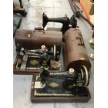 Three vintage Singer sewing machines