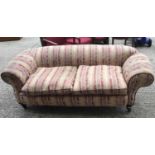 Victorian chesterfield settee with drop-end on turned mahogany legs